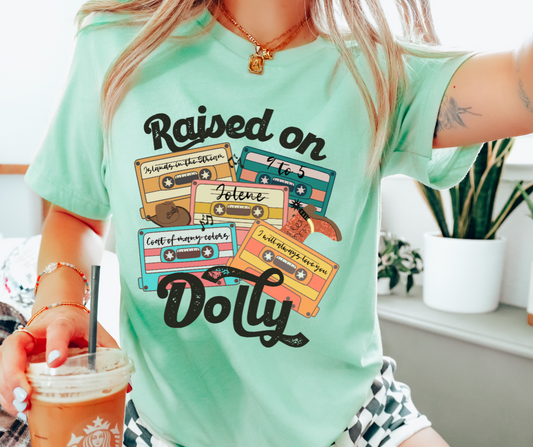 RAISED ON DOLLY GRAPHIC TEE