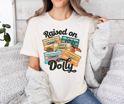 RAISED ON DOLLY GRAPHIC TEE