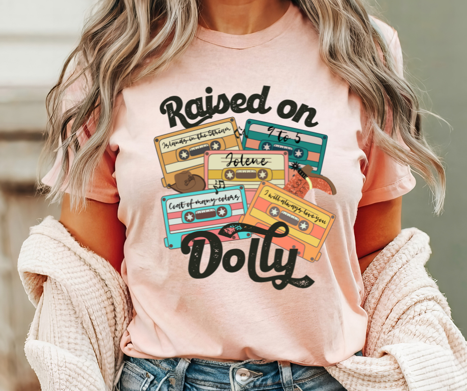 RAISED ON DOLLY GRAPHIC TEE