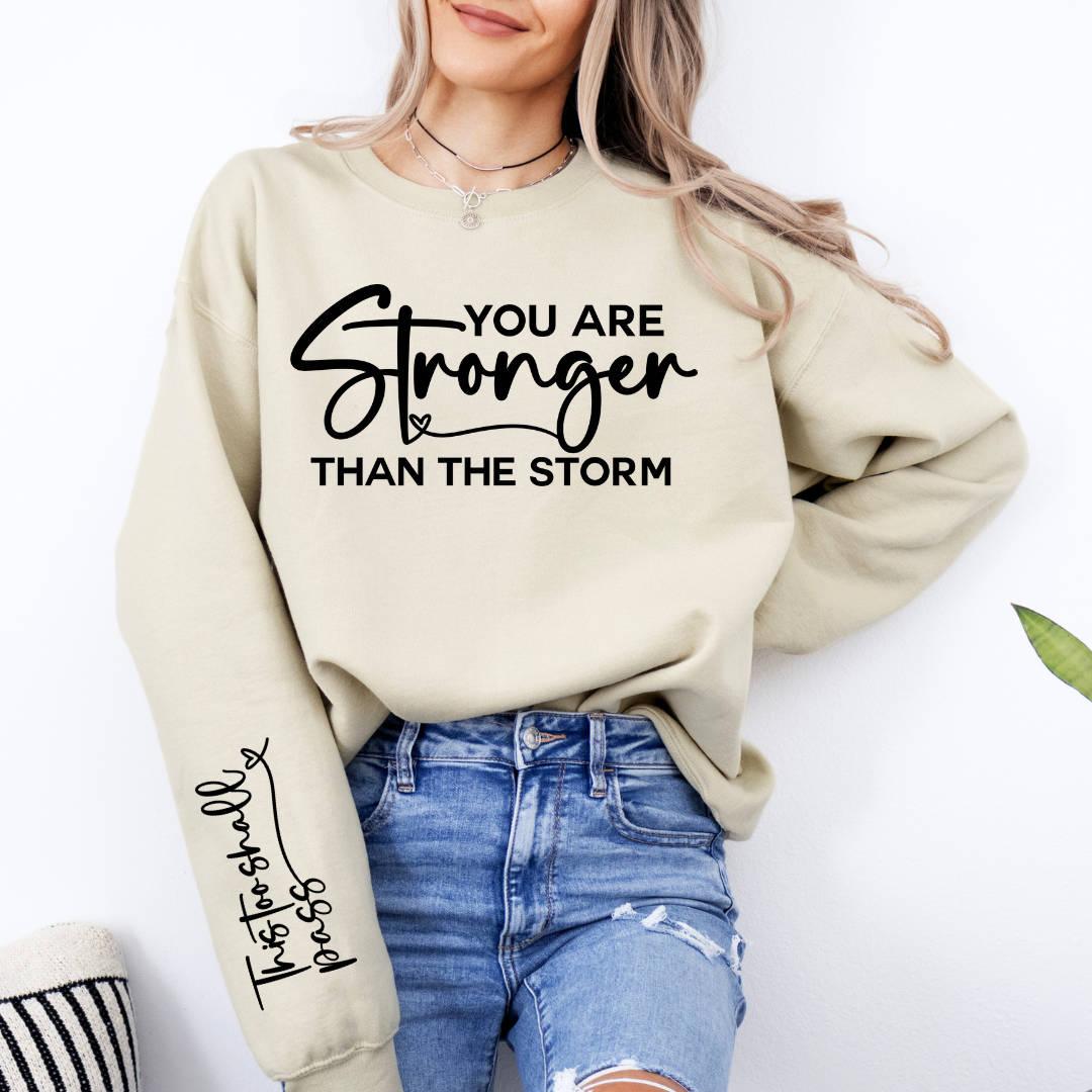 STRONGER THAN THE STORM SWEATSHIRT